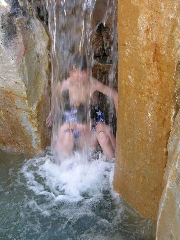 Grandchildren Play Behind Swim-In Waterfall, Manheim, Pa