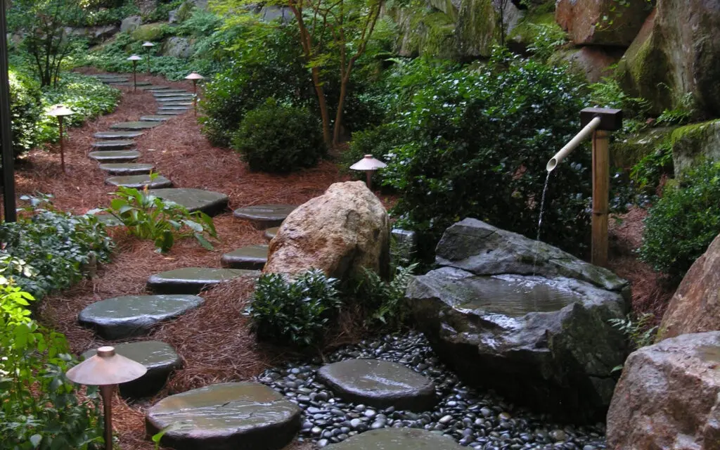 A Path In A Forest With Rocks And Trees