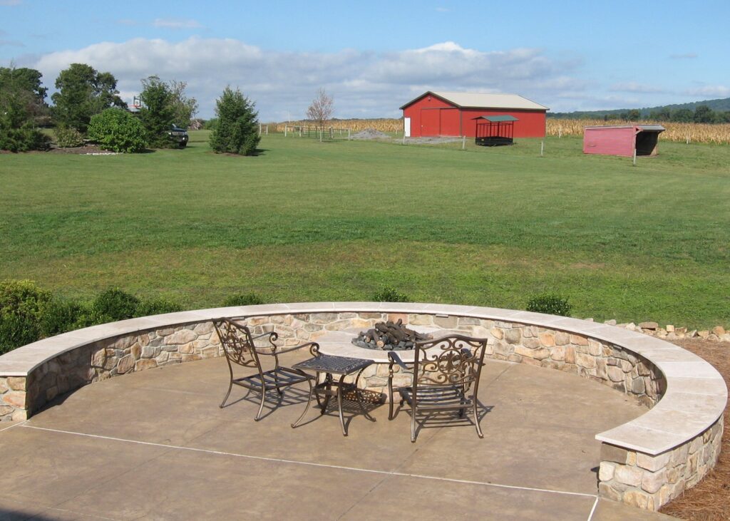 Rural Farm Vista Surrounds This Stone Fire Pit With Gas Fire And Seating Wall, Manheim, Pa