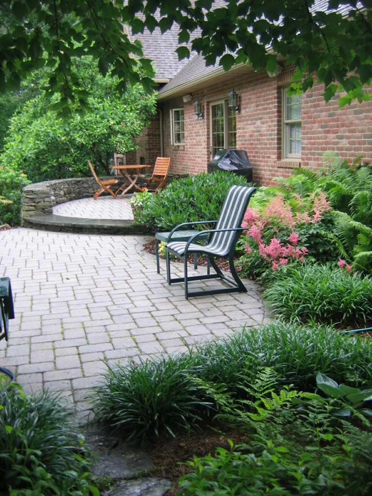 Stone Seating Walls That Embrace Multi-Level Patios In Morgantown, Pa Thanks To Hanselman Landscape'S Patio Contractors.