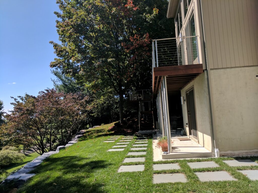 Contemporary Bluestone Squares Softened By Lawn Grid In A Yard Maintained By Patio Contractors In Lititz, Pa