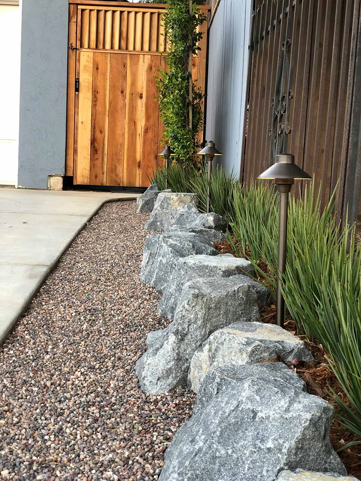 Rugged Boulders Form Retaining Wall And Gravel Curb, San Diego, Ca