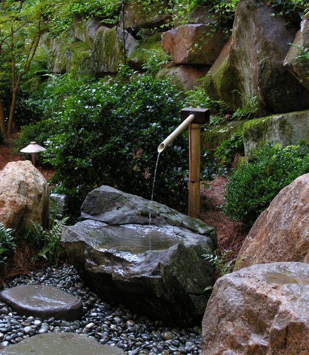 Well-Planted Boulders And A Tsukubai Water Feature Add Structure And Beauty To A Japanese-Inspired Garden