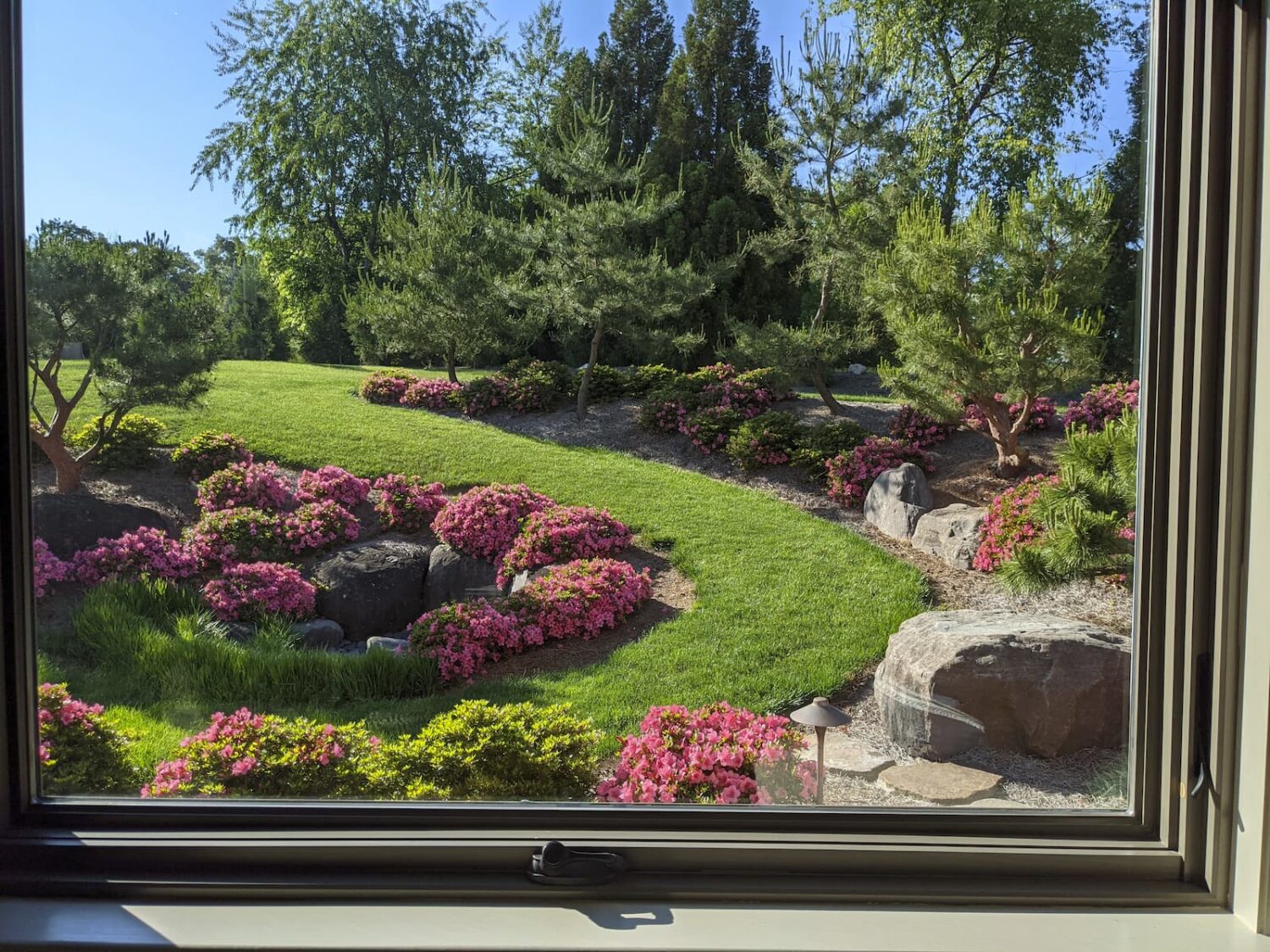 A Window View Of A Large Inside Out Garden Designed And Installed By Hanselman Gardens In Lancaster, Pa.