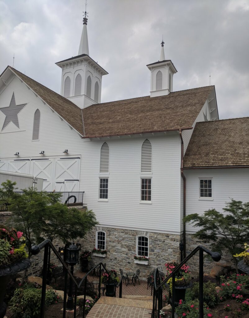 Terraced Plantings Line The Slope Between Levels Of The Historic Star Barn In Central Pa.