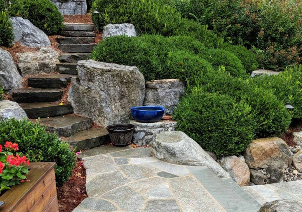 A Backyard Japanese Garden Idea That Incorporates Evergreens And Stone Stairs In Its Design.
